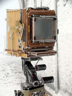 Camera with wind enclosure, accumulating rime ice